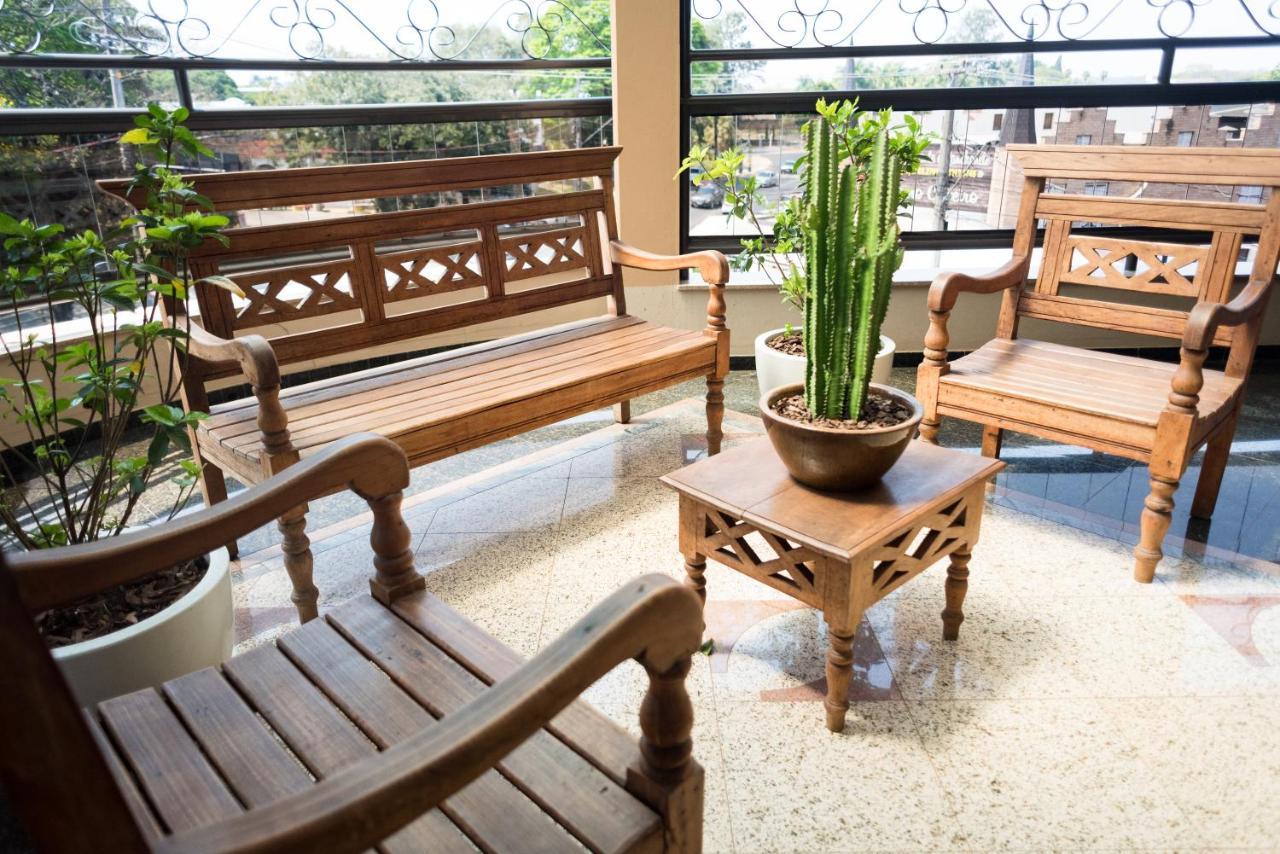 Holambra Garden Hotel Extérieur photo A set of Thai style wooden furniture
